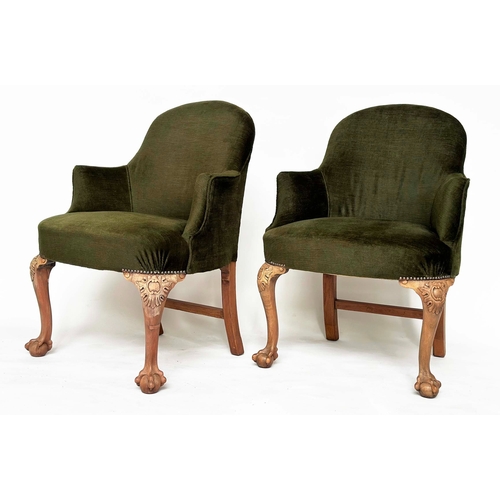 106 - ARMCHAIRS, a pair, early 20th century tub-form moss green velvet upholstered with carved walnut cabr... 