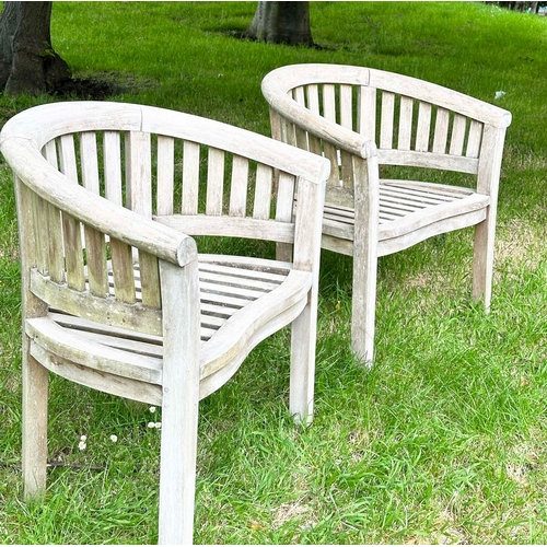 146 - BANANA GARDEN ARMCHAIRS, a pair, well weathered teak, slatted with rounded backs, 82cm H x 78cm W. (... 