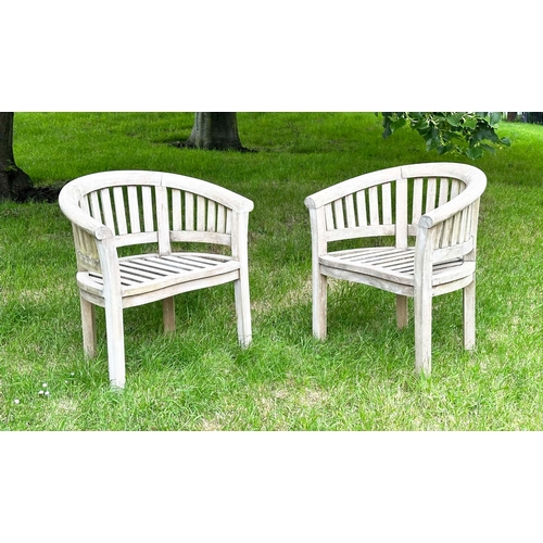 146 - BANANA GARDEN ARMCHAIRS, a pair, well weathered teak, slatted with rounded backs, 82cm H x 78cm W. (... 