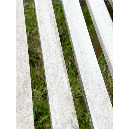 146 - BANANA GARDEN ARMCHAIRS, a pair, well weathered teak, slatted with rounded backs, 82cm H x 78cm W. (... 