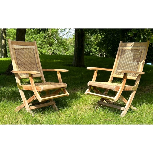 155 - WESTMINSTER FOLDING ARMCHAIRS, a pair, teak framed and cane panelled, 101cm H x 56cm W. (2)