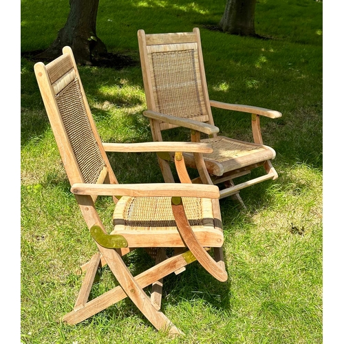 155 - WESTMINSTER FOLDING ARMCHAIRS, a pair, teak framed and cane panelled, 101cm H x 56cm W. (2)