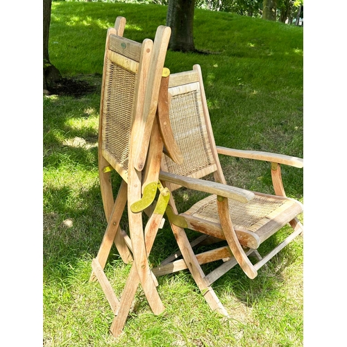 155 - WESTMINSTER FOLDING ARMCHAIRS, a pair, teak framed and cane panelled, 101cm H x 56cm W. (2)