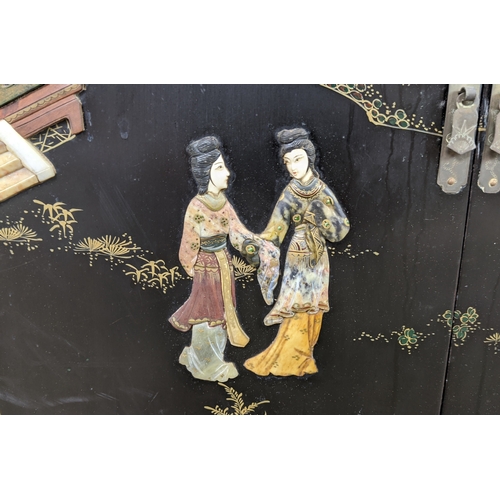 172 - SIDE CABINETS, a pair, Chinese black lacquer, gilt and relief decorated, each with two doors, 77cm H... 