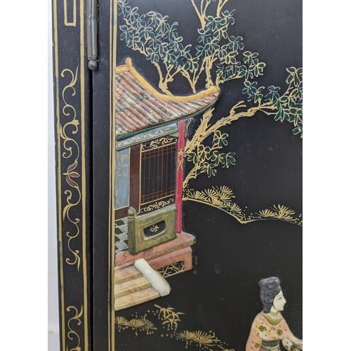 172 - SIDE CABINETS, a pair, Chinese black lacquer, gilt and relief decorated, each with two doors, 77cm H... 