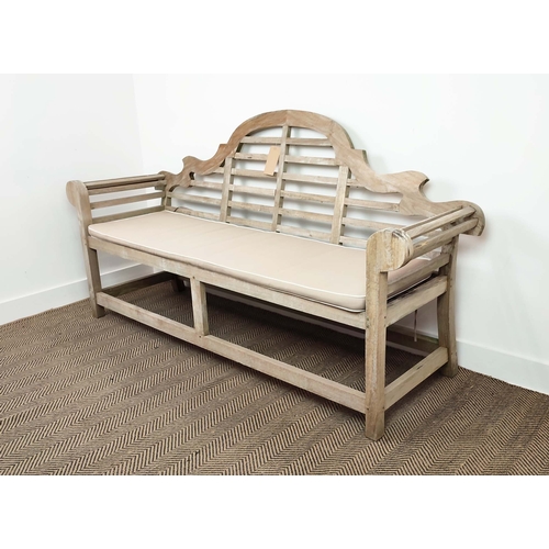 185 - GARDEN BENCH, Lutyens style in weathered teak, 196cm L x 105cm H, with cushion.