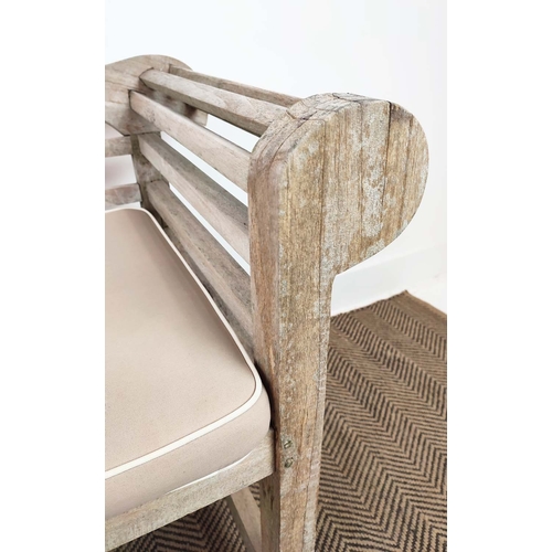 185 - GARDEN BENCH, Lutyens style in weathered teak, 196cm L x 105cm H, with cushion.