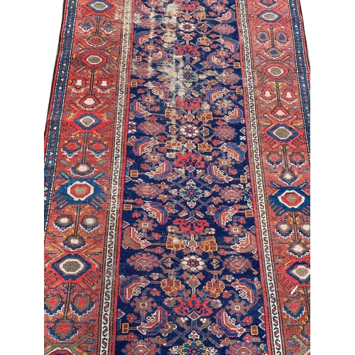 82 - ANTIQUE MALAYER RUNNER, 475cm x 104cm.