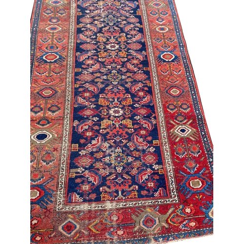 82 - ANTIQUE MALAYER RUNNER, 475cm x 104cm.