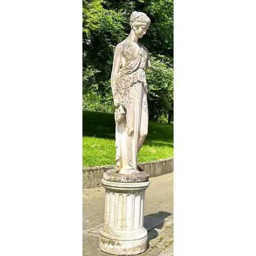 149 - GARDEN STATUE WATER CARRIER, well weathered reconstituted stone on a circular fluted plinth, 227cm H... 