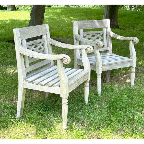 150 - COLONIAL STYLE GARDEN ARMCHAIRS, a pair, nicely weather high grade teak, each with pierced trellis c... 