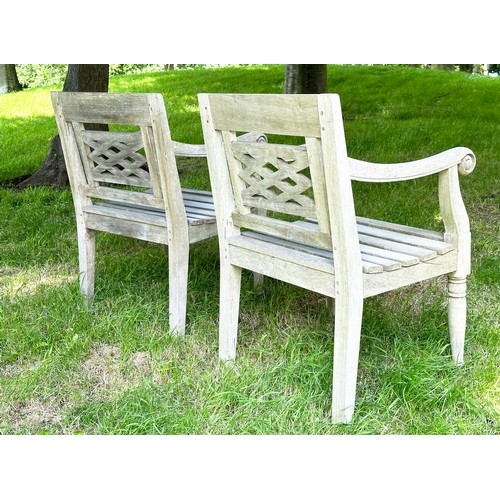 150 - COLONIAL STYLE GARDEN ARMCHAIRS, a pair, nicely weather high grade teak, each with pierced trellis c... 