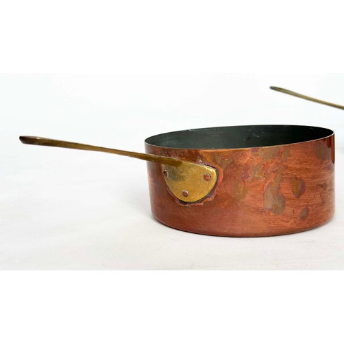 297 - COPPER PANS, a graduated set of five copper and brass, largest 18cm W. (5)
