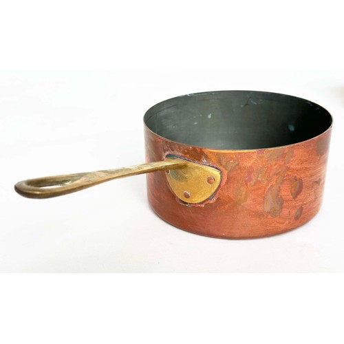 297 - COPPER PANS, a graduated set of five copper and brass, largest 18cm W. (5)