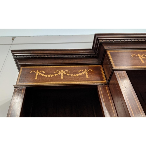 165 - EDWARDIAN SHERATON-STYLE BREAKFRONT LINE INLAID MAHOGANY BOOKCASE, having moulded dentil cornice ove... 