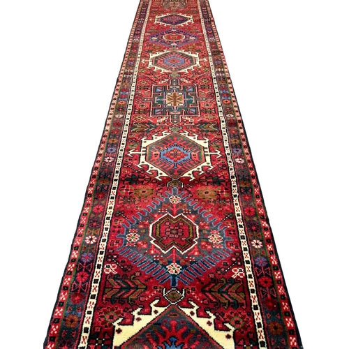 64 - PERSIAN KARAJA LONG RUNNER, 395cm x 72cm.