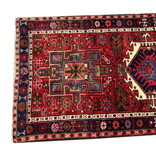 64 - PERSIAN KARAJA LONG RUNNER, 395cm x 72cm.