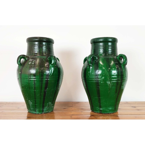 272 - GARDEN URNS, a pair, green glazed terracotta, 58cm H x 35cm W. (2)