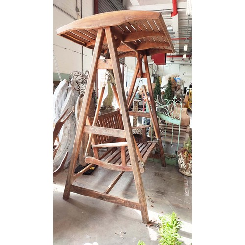 187 - GARDEN SWING SEAT, slatted teak on A frame stretched supports, 195cm H x 150cm W x 103cm D.