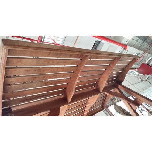 187 - GARDEN SWING SEAT, slatted teak on A frame stretched supports, 195cm H x 150cm W x 103cm D.