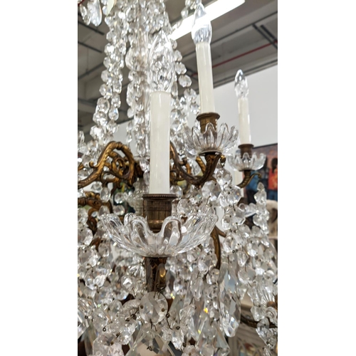 392 - CHANDELIER, gilt metal and cut glass, 110cm drop approx.