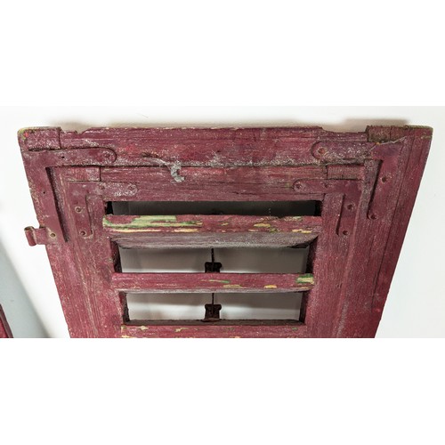 180 - PAIR OF ANTIQUE FRENCH WOODEN WINDOW SHUTTERS, late 19th/early 20th century, rustic red painted fini... 