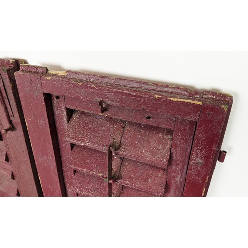 180 - PAIR OF ANTIQUE FRENCH WOODEN WINDOW SHUTTERS, late 19th/early 20th century, rustic red painted fini... 