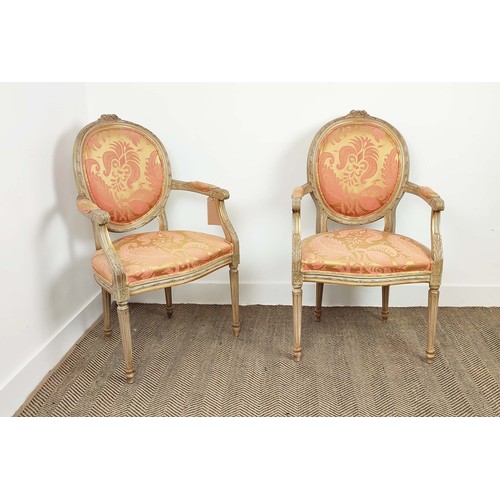 138 - FAUTEUILS, a pair, louis XVI style painted, in silk damask upholstery, with fluted supports, each 61... 