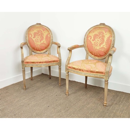 138 - FAUTEUILS, a pair, louis XVI style painted, in silk damask upholstery, with fluted supports, each 61... 