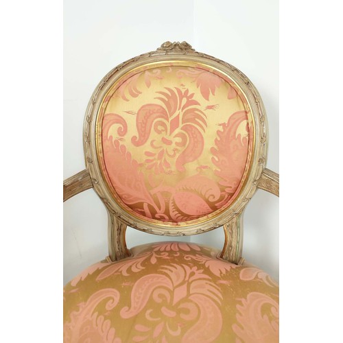 138 - FAUTEUILS, a pair, louis XVI style painted, in silk damask upholstery, with fluted supports, each 61... 