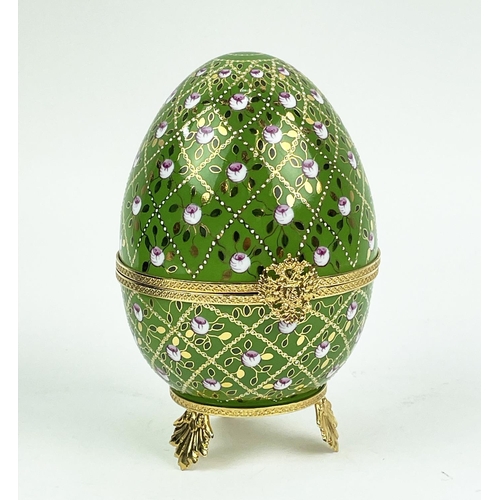 107 - MUSICAL FABERGE EGG, number 25, green and gilt ceramic with hand painted rose decoration, hinged lid... 