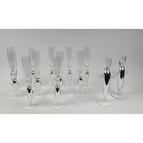 111 - ANGEL CHAMPAGNE GLASSES, a collection of eleven and a near pair of candlesticks, silver with angel w... 