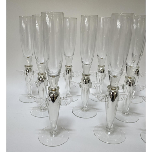 111 - ANGEL CHAMPAGNE GLASSES, a collection of eleven and a near pair of candlesticks, silver with angel w... 