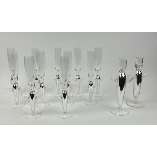 111 - ANGEL CHAMPAGNE GLASSES, a collection of eleven and a near pair of candlesticks, silver with angel w... 