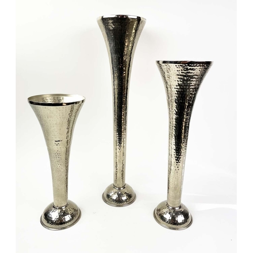 120 - FLUTED VASES, a graduated set of three, in hammered metal, 51cm H. (3)