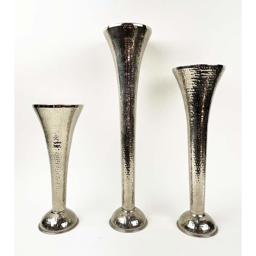 120 - FLUTED VASES, a graduated set of three, in hammered metal, 51cm H. (3)