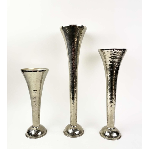 120 - FLUTED VASES, a graduated set of three, in hammered metal, 51cm H. (3)