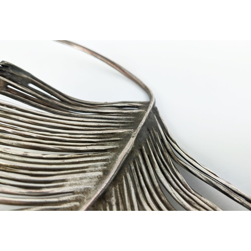 121 - YASEMEN HUSSEIN SILVER PLATED COPPER WIRE FEATHER, 40cm L.