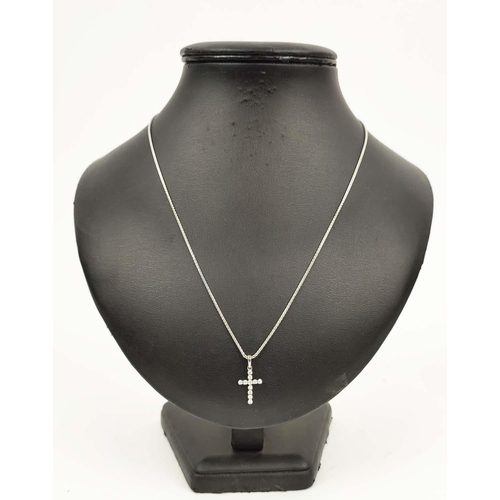 152 - A 14CT WHITE GOLD DIAMOND SET CROSS PENDANT NECKLACE, the cross set with eleven round
brilliant cut ... 