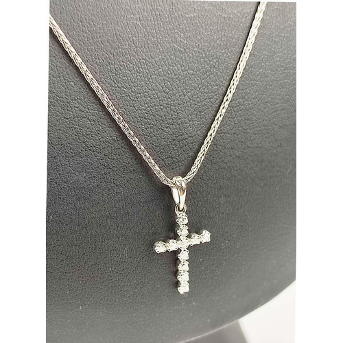 152 - A 14CT WHITE GOLD DIAMOND SET CROSS PENDANT NECKLACE, the cross set with eleven round
brilliant cut ... 