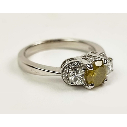 159 - A 14CT WHITE GOLD THREE STONE DIAMOND RING, the central yellow coloured fancy diamond of approximate... 