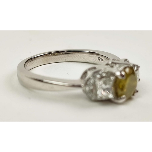 159 - A 14CT WHITE GOLD THREE STONE DIAMOND RING, the central yellow coloured fancy diamond of approximate... 