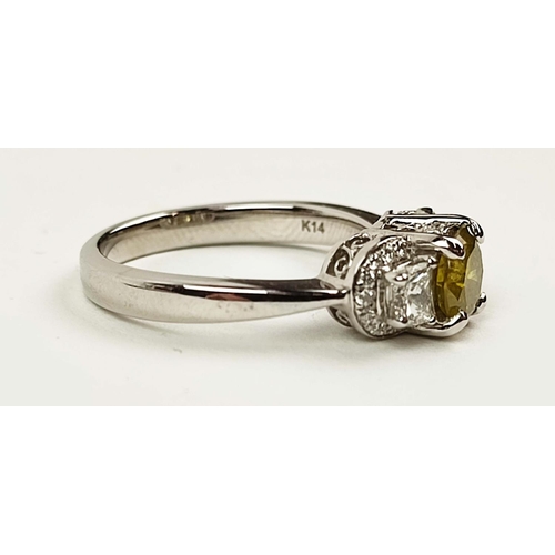 159 - A 14CT WHITE GOLD THREE STONE DIAMOND RING, the central yellow coloured fancy diamond of approximate... 