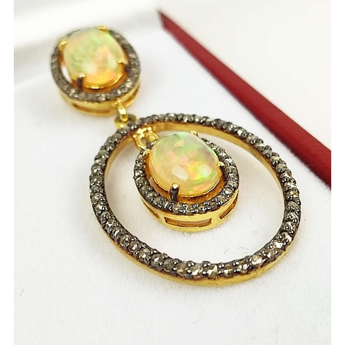 162 - A PAIR OF OPAL SET ARTICULATED DROPLET EARRINGS, each with two opal cabouchons, diamond set surround... 