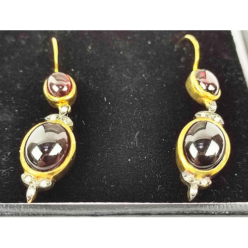 164 - A PAIR OF GARNET HOOK PENDANT EARRINGS, each earring set with two garnet cabouchons and trefoil diam... 