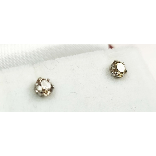 165 - A PAIR OF DIAMOND SET STUDS EARRINGS, each claw set with a round brilliant cut diamond of approximat... 