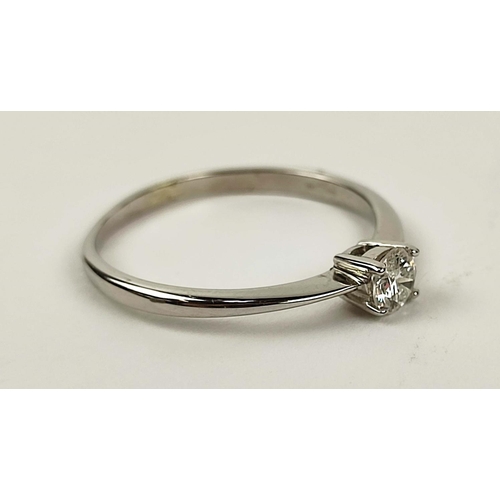 166 - A DIAMOND SOLITAIRE RING, 9ct white gold shank, the single round brilliant cut stone claw set, ring ... 