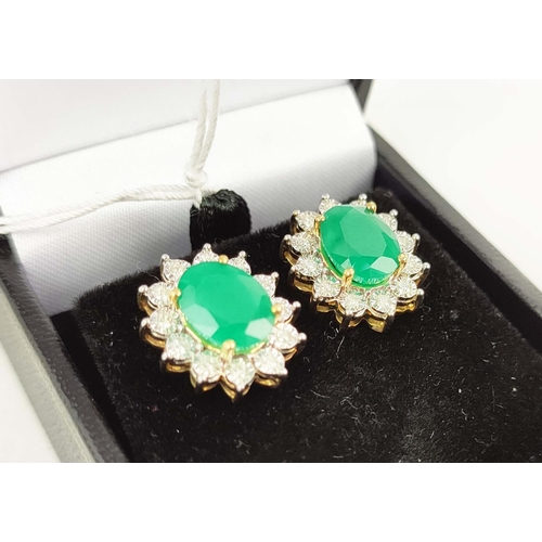 167 - A PAIR OF EMERALD AND DIAMOND EARRINGS, each with a single oval mixed cut emerald of approximately 1... 