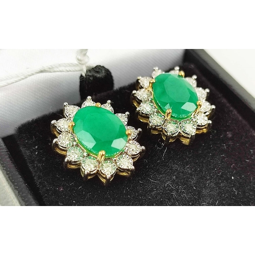 167 - A PAIR OF EMERALD AND DIAMOND EARRINGS, each with a single oval mixed cut emerald of approximately 1... 