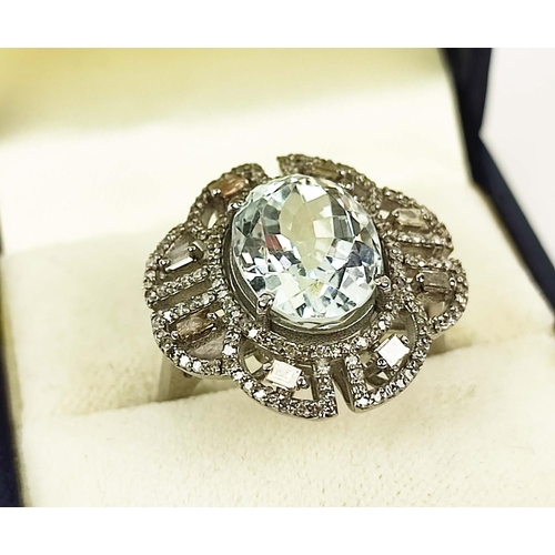 168 - AN AQAUAMARINE AND DIAMOND ENCRUSTED DRESS RING, the large claw set oval mixed cut aquamarine of app... 